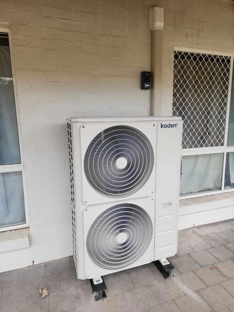 Ducted system outdoor unit levelled and mounted on feet