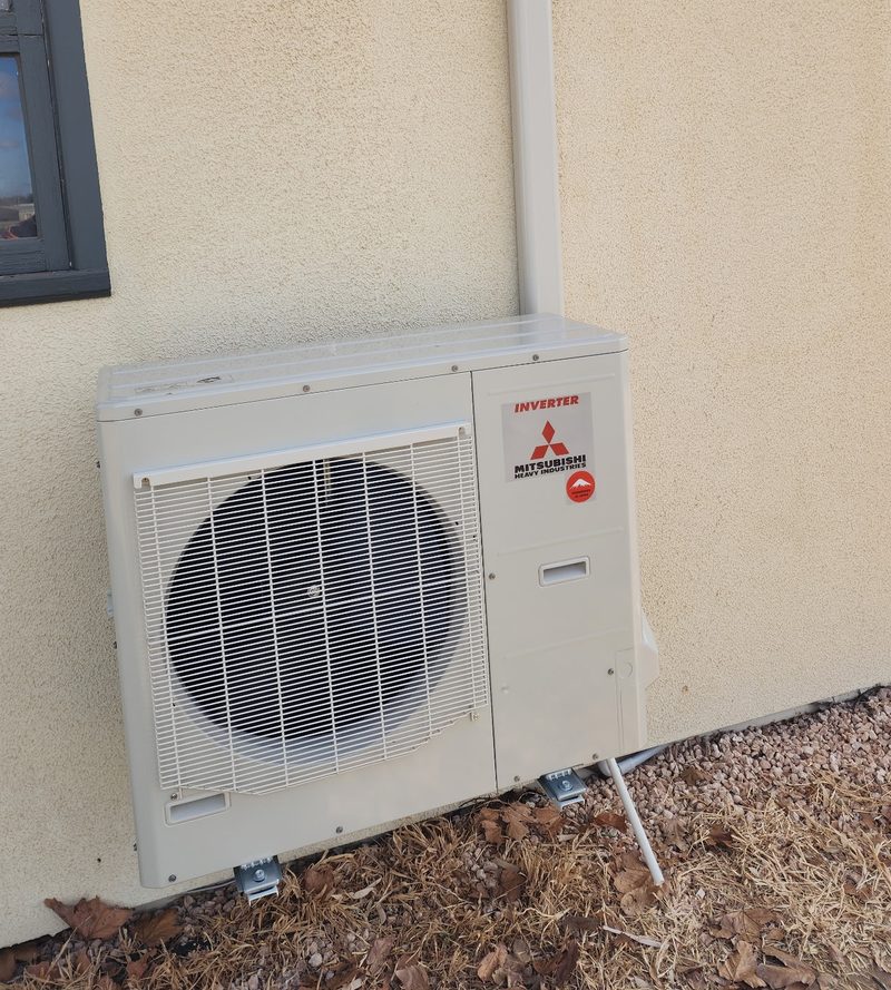 Outdoor unit on a rendered home
